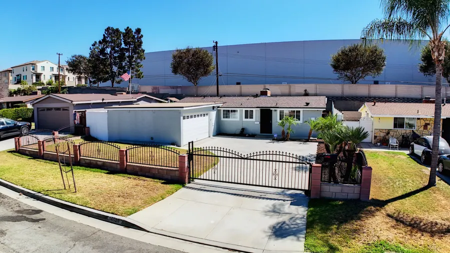 Aerial view of 14020 Bora Dr and its gated front yard